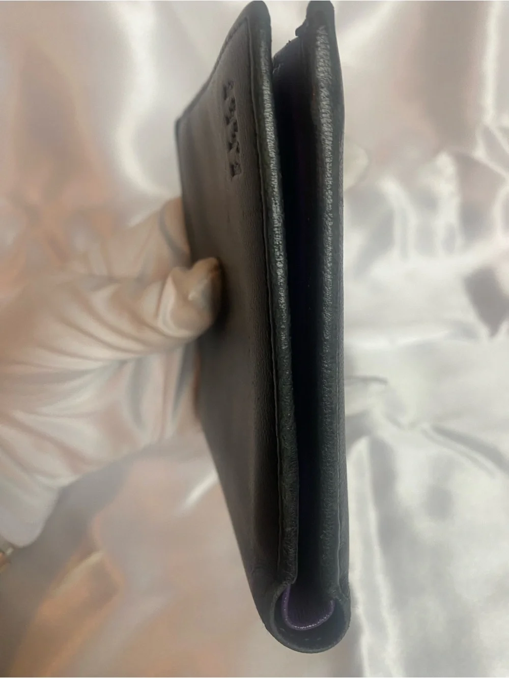 Classic Black Leather Bi-Fold Wallet with Subtle Embossed Logo